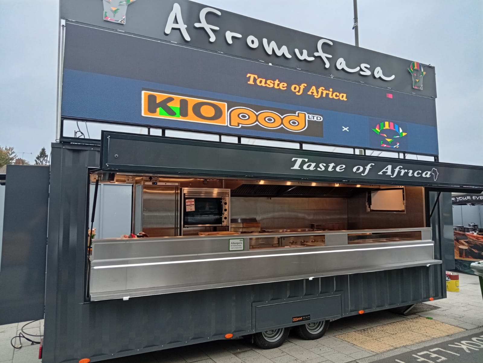 Afromufasa container-style catering trailer with serving hatch open