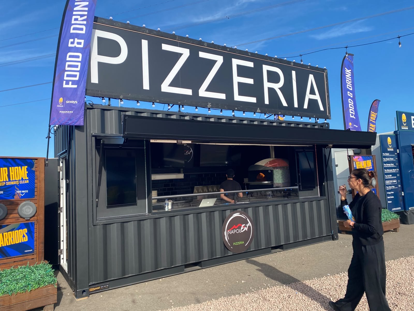 Napoleat shipping container pizzeria conversion at an outdoor venue