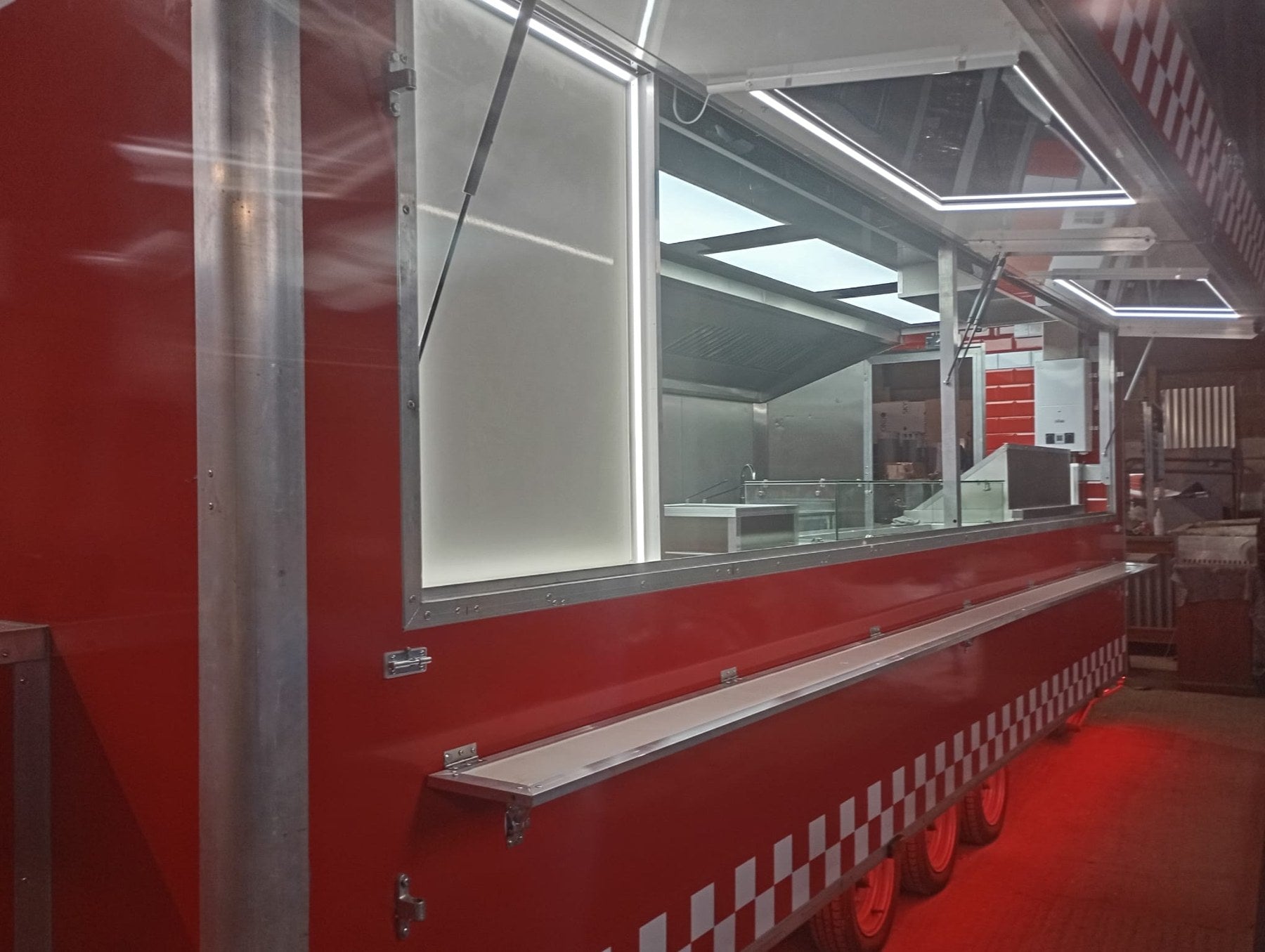 Red catering trailer serving hatch and drop-down customer shelf