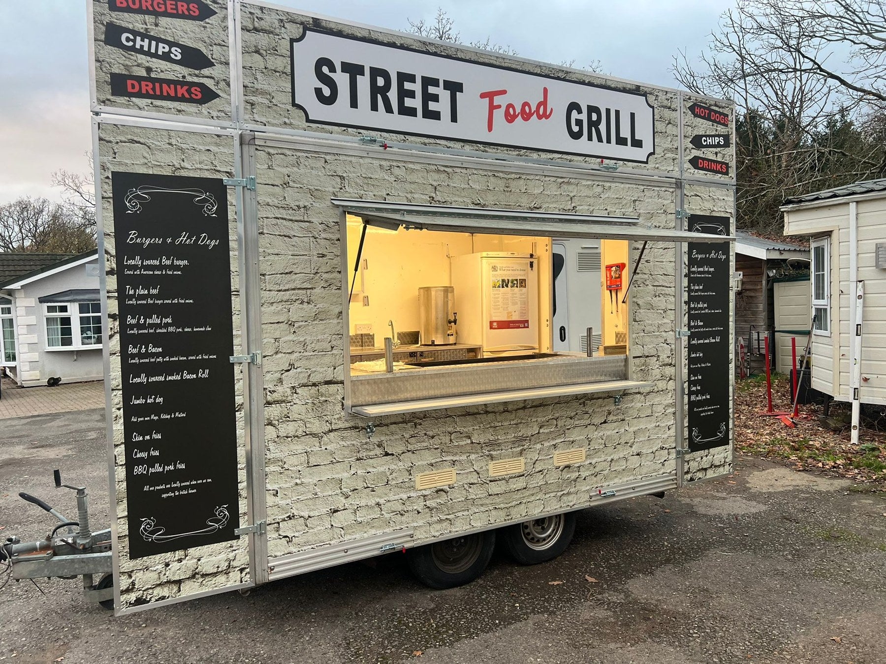 Street Food Grill catering trailer with front serving hatch and menu boards
