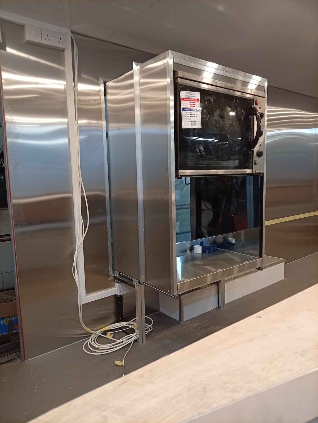 Stainless steel cooking line and extraction inside the Afromufasa trailer