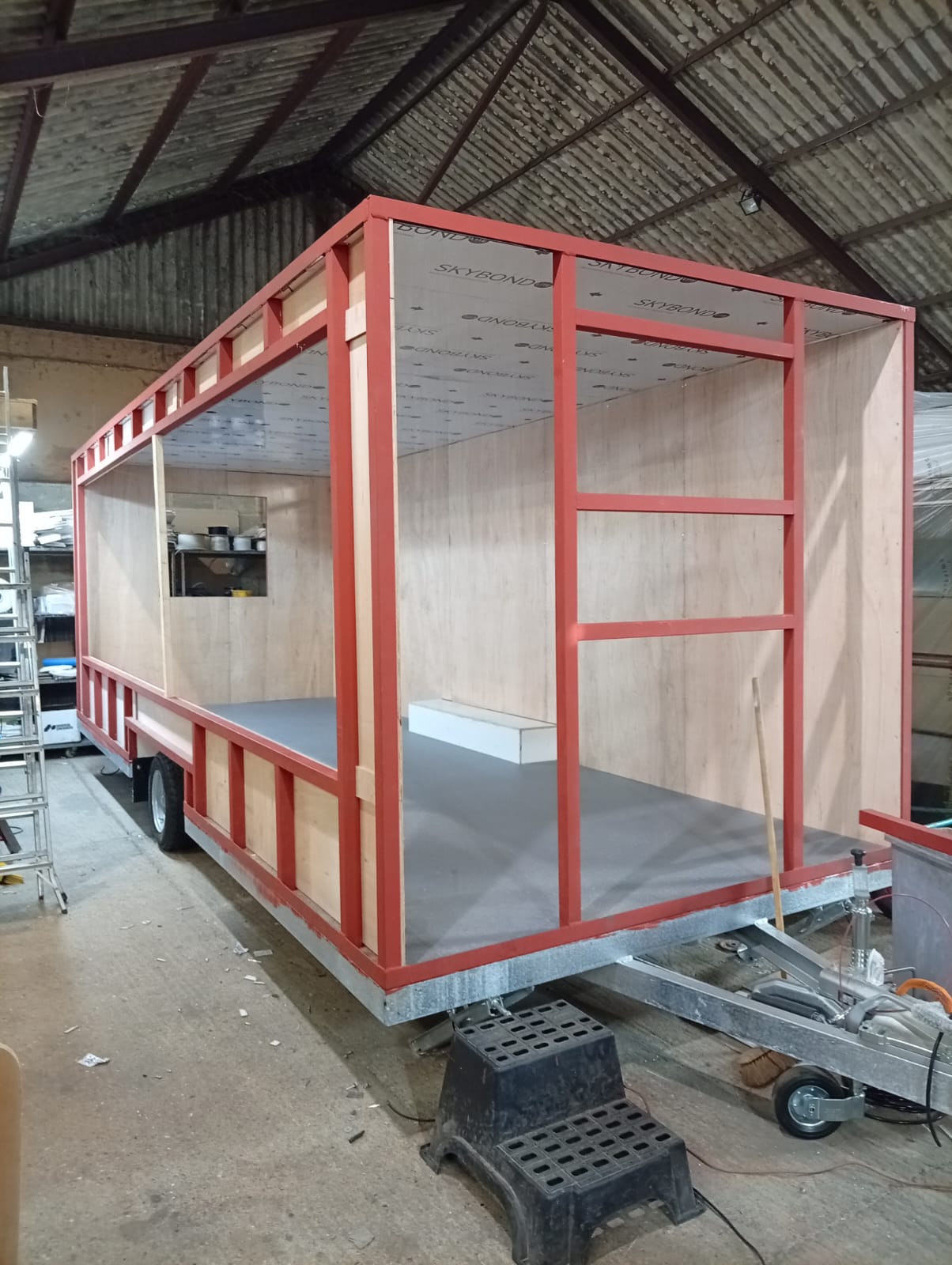 Steel box frame on a galvanised catering trailer chassis during construction
