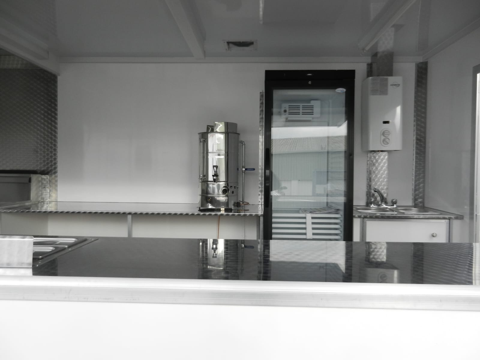 Modern kitchen with stainless steel appliances and white cabinets